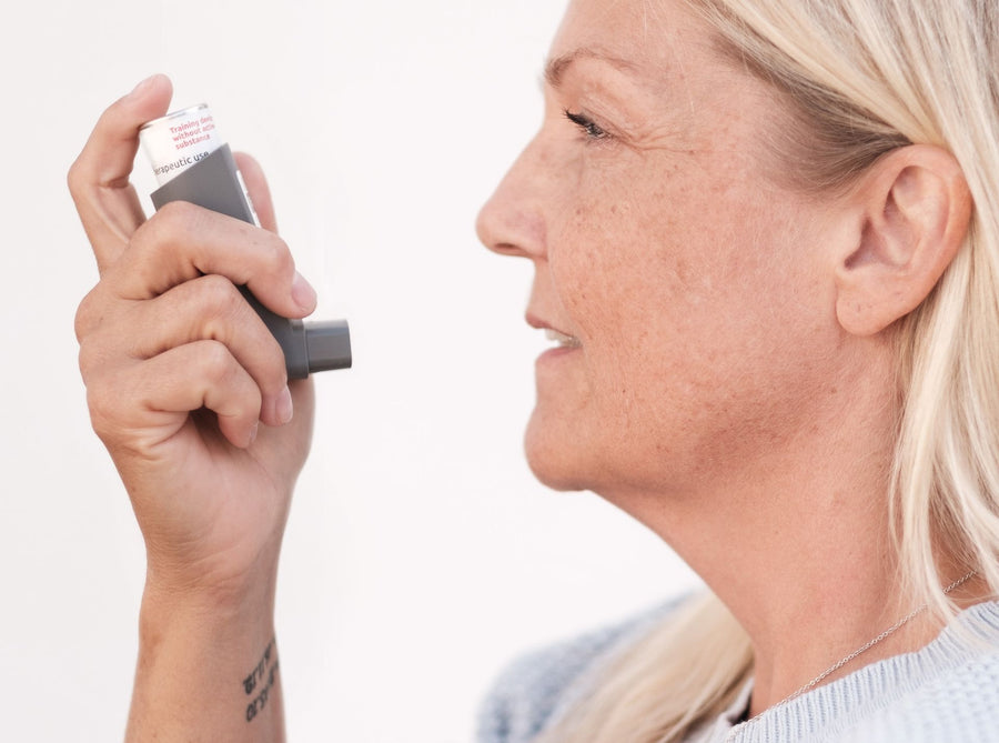 Person with asthma completing an online repeat treatment form at home