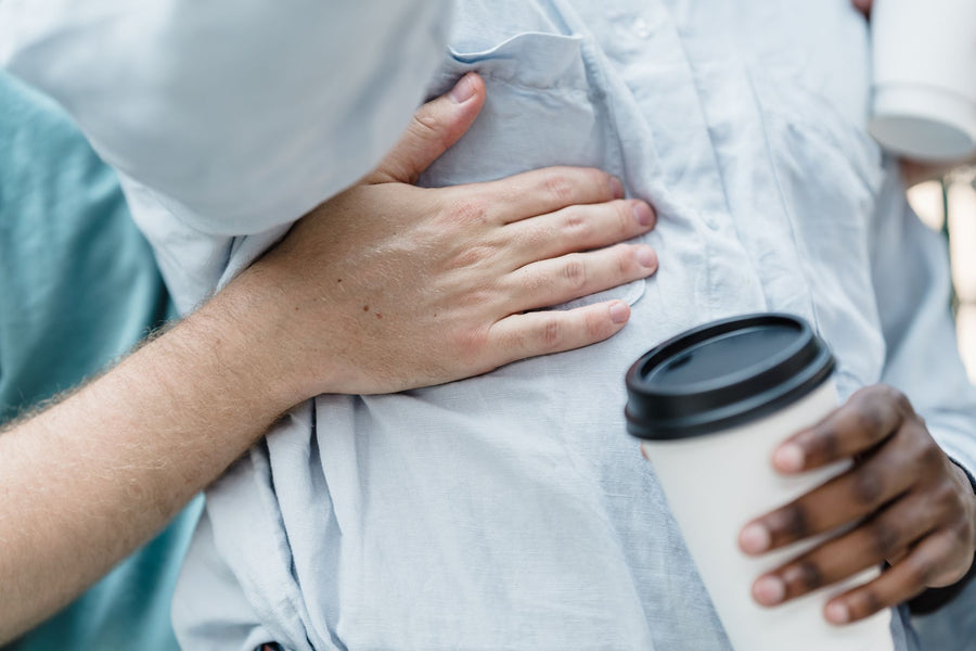 Person enjoying a meal comfortably after treating acid reflux