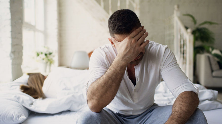Man reading about premature ejaculation treatment options privately on his phone at home